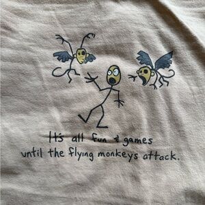Vintage Beige Graphic T-Shirt with Flying Monkeys Design